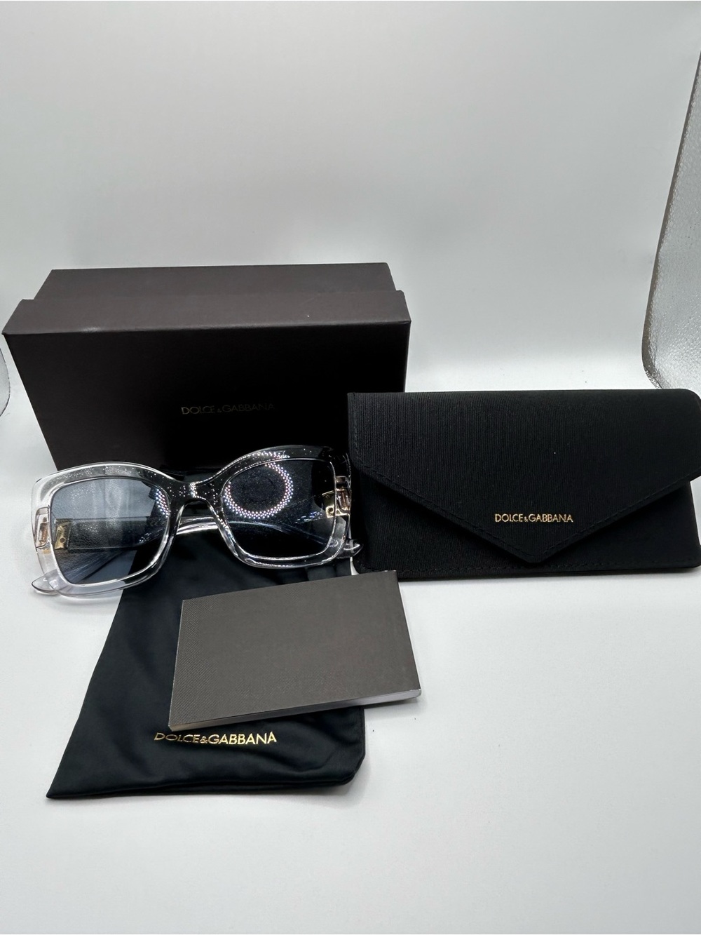 Dolce & Gabbana Clear Frame Sunglasses with Black-Gray Lenses